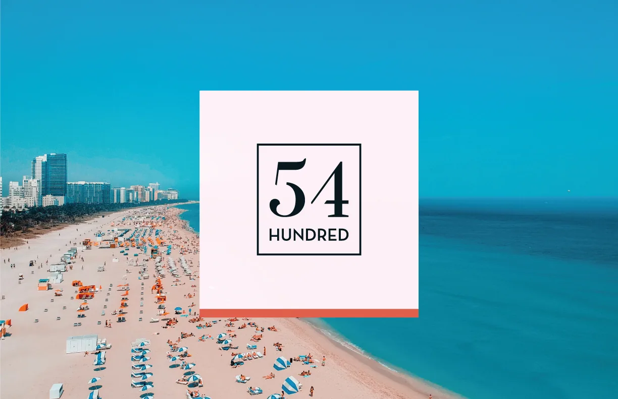 Framed 54 Hundred mark set over an aerial Miami beach image